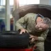 Mechanic examining a tyre in repair garage