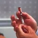 Vaccine. Doctor preparing a measles vaccine. He is using a hypodermic syringe to dissolve the powdered vaccine (vial, upper centre) with a solvent. Vaccination against measles in childhood can provide long-term protection. The injection of components of the virus particle causes the response of the immune system to be stronger when measles infections occur in the future., Image: 102389811, License: Rights-managed, Restrictions: , Model Release: no, Credit line: Science Photo Library / Sciencephoto / Profimedia