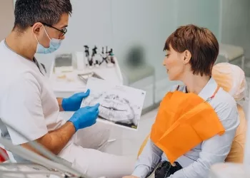implant dentar pret
