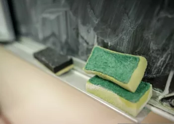 Shallow depth of field (selective focus) details with a sponge used for cleaning the blackboard from chalk in the classroom of a primary school.