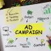Notebook with Toolls and Notes about Ad Campaign
