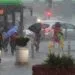 Bucharest, Romania. 9th Jun, 2025: People cross a heavily flooded street after a strong storm rain in Bucharest.